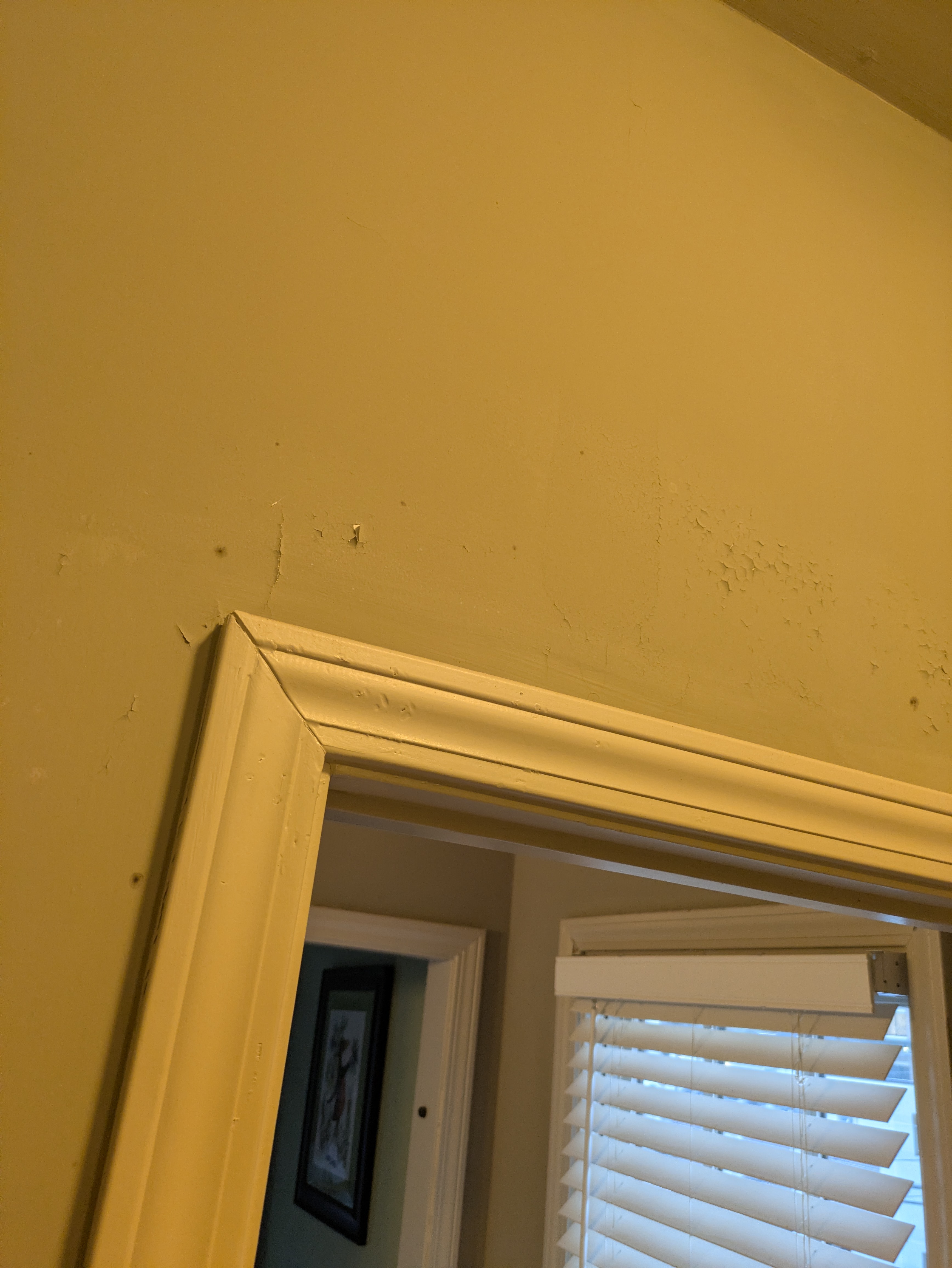 Grouting grey slate floor tiles in an Athens GA home